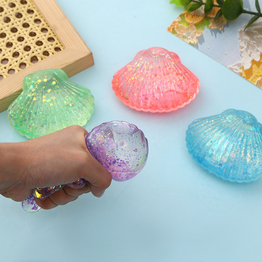 R1448  Glitter Shell Stress Relief Squish Ball Toy
